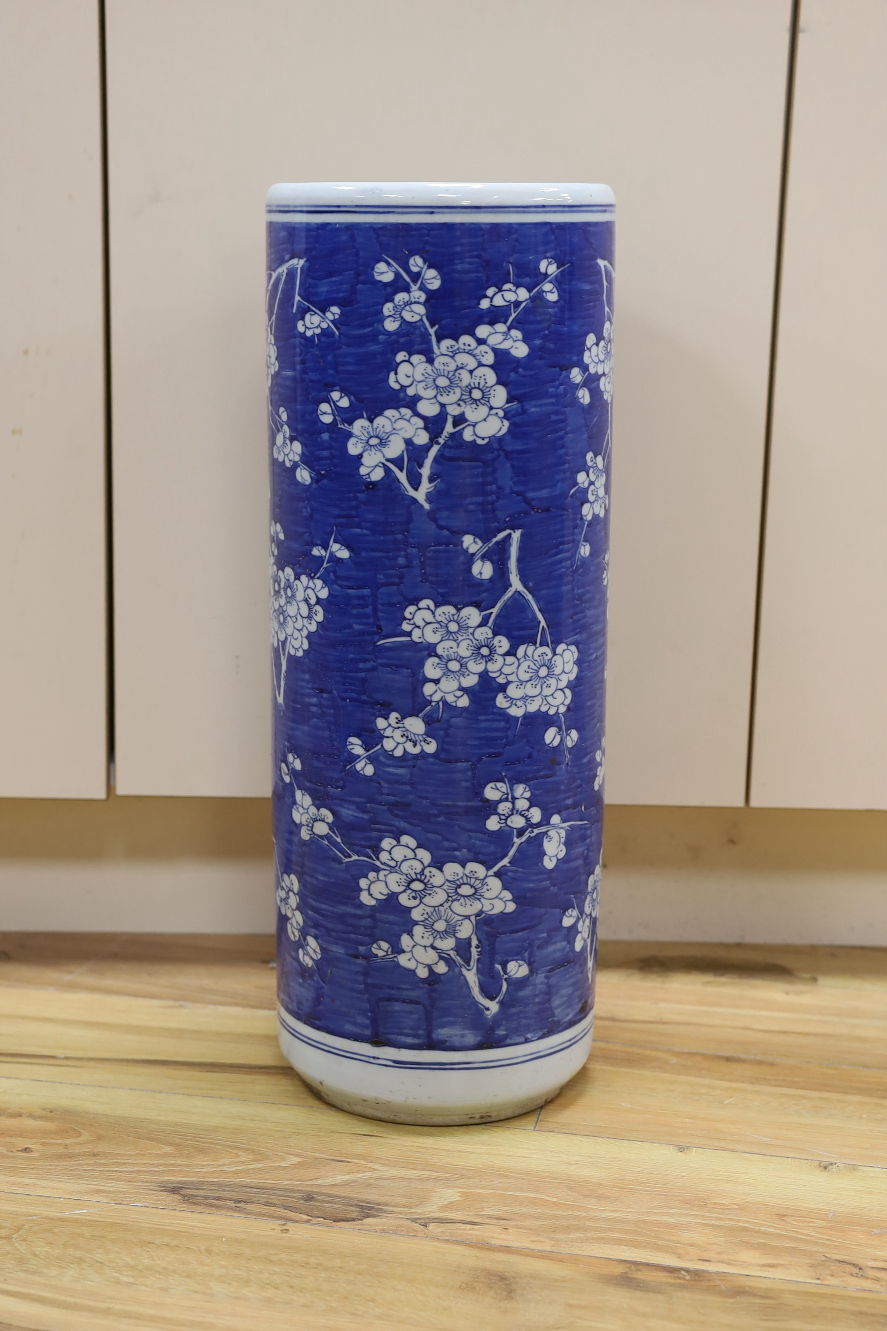 An early 20th century Chinese blue and white stick stand, 62cm